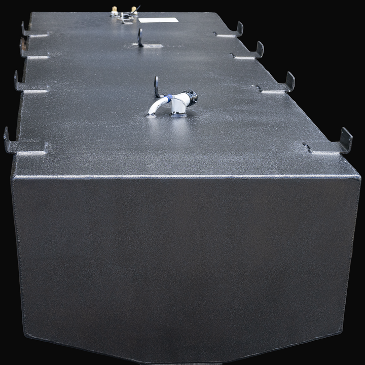 Large rectangular black OEM replacement belly fuel tank for Mako 261, 1990 model, with rounded front corners and multiple mounting brackets along the top edges. The top surface includes several fittings and connectors, including a white pipe with a black cap. The tank has a textured finish