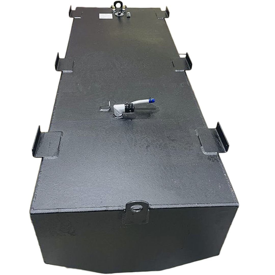 A dark grey, irregularly shaped metal tank with a textured surface is shown from an elevated perspective against a black and grey checkered background. The tank's top features several L-shaped mounting brackets along its edges, and various fittings, including a white, curved pipe with a blue tip, and a cluster of nozzles and a white label at one end. The bottom edge of the tank is slightly curved