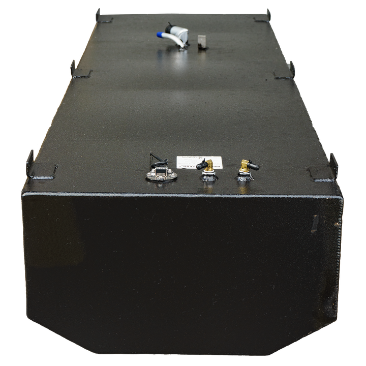 A close-up elevated view of a dark rectangular fuel tank, featuring multiple ports, including a fuel gauge and connection points, with a black textured surface and a label attached. The image shows the tank's flat top and distinct edges against a transparent background