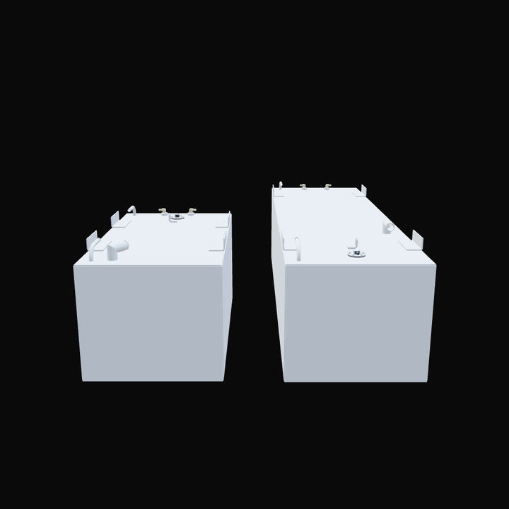 Two rectangular, light gray fuel tanks are shown against a black background. The tank on the left is shorter and wider, while the one on the right is longer and narrower. Both tanks have various fittings, pipes, and mounting brackets on their top surfaces