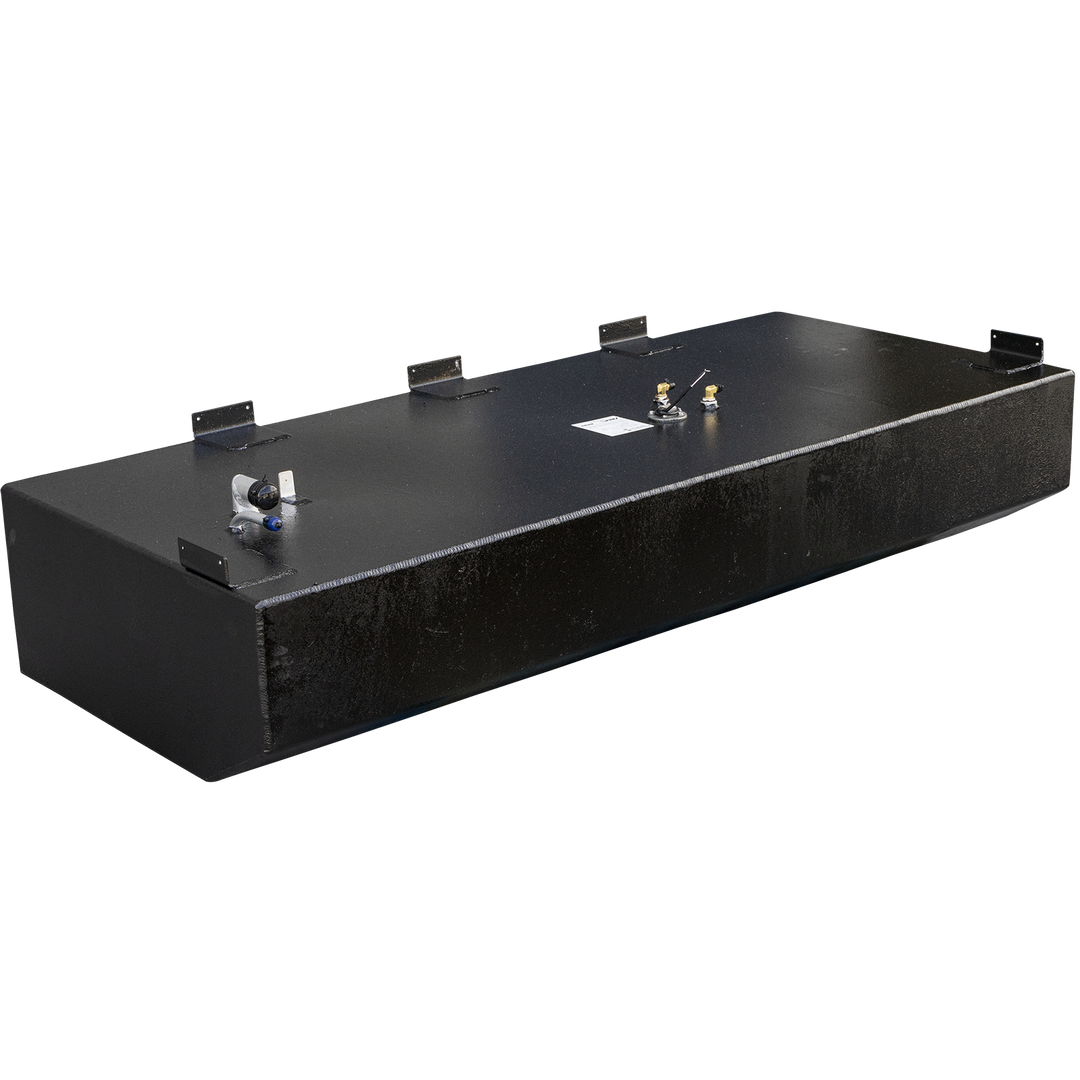 A long, rectangular black fuel tank with a textured surface and a flat top. The tank has a recessed section along its lower front edge. Various fittings are visible on the top surface, including a white L-shaped pipe with a blue tip on the left, a circular fitting with small metal tubes on the right, and several metal brackets attached to the edges