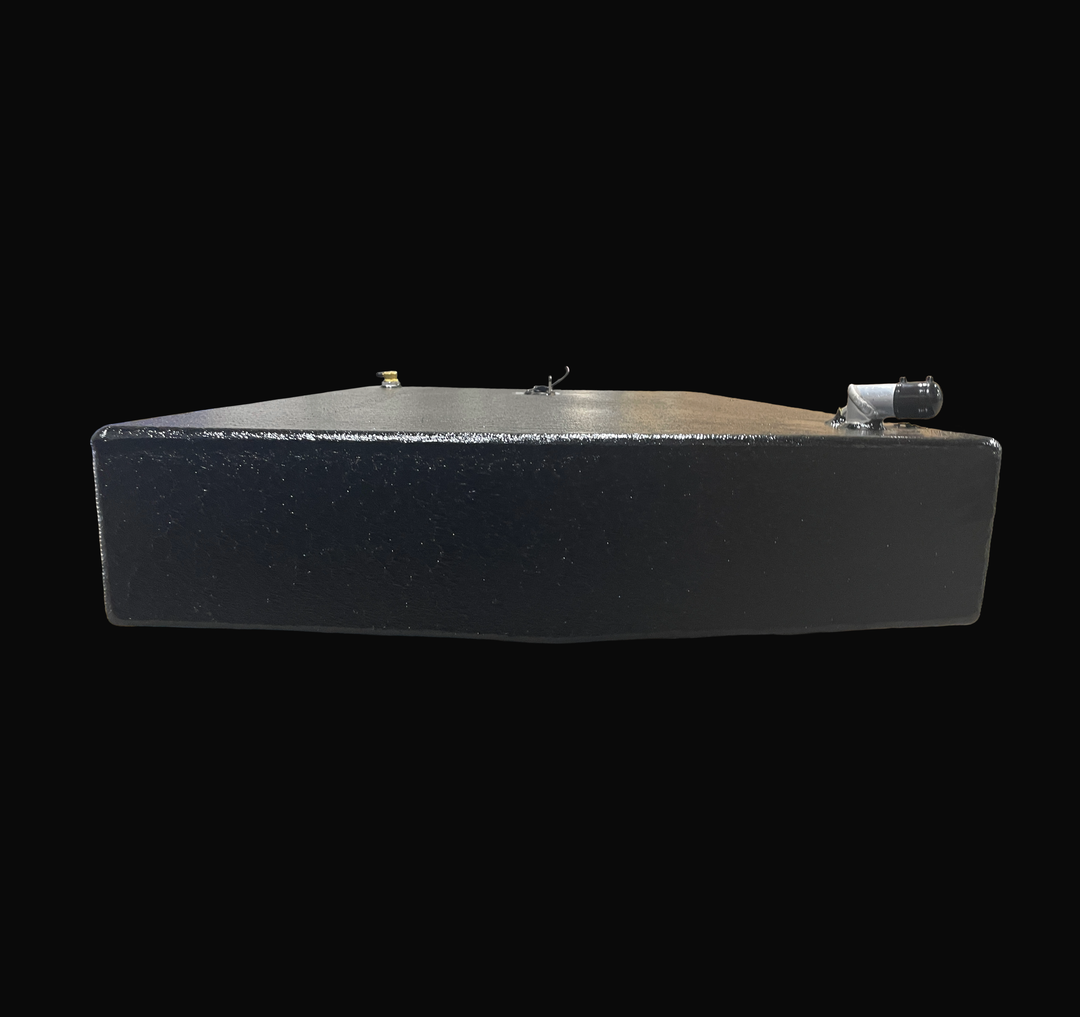 A studio low-angle end view highlighting the subtle V-hull deadrise contour of a physical, finished black encapsulated Robalo 19 OEM replacement marine fuel tank (73 gal) from file image_2812d0.jpg, isolated against a black background. Precision-fabricated from heavy-gauge marine-grade 5052-H32 aluminum, the low-profile hull-conformed cell is fully encapsulated in a protective, textured black TarGard epoxy coating to resist severe saltwater pitting and bilge moisture decay. Visible top deck hardware include