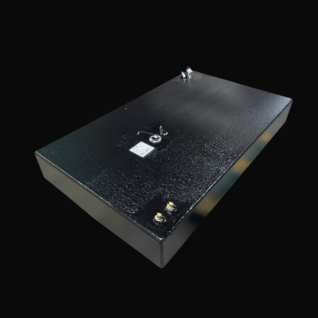 A studio high-angle isometric view displaying the full body of a physical, finished black encapsulated Robalo 19 OEM replacement marine fuel tank (73 gal) from file image_28044c.jpg, isolated against a black background. Precision-fabricated from heavy-gauge marine-grade 5052-H32 aluminum, the rectangular hull-contoured body is fully encapsulated in a protective, textured black TarGard epoxy coating to resist severe saltwater pitting and bilge moisture decay. Top deck hardware includes dual brass 90-degree f