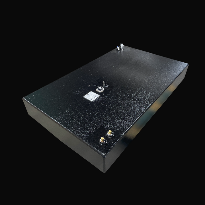A studio high-angle isometric view displaying the full body of a physical, finished black encapsulated Robalo 19 OEM replacement marine fuel tank (73 gal) from file image_28044c.jpg, isolated against a black background. Precision-fabricated from heavy-gauge marine-grade 5052-H32 aluminum, the rectangular hull-contoured body is fully encapsulated in a protective, textured black TarGard epoxy coating to resist severe saltwater pitting and bilge moisture decay. Top deck hardware includes dual brass 90-degree f