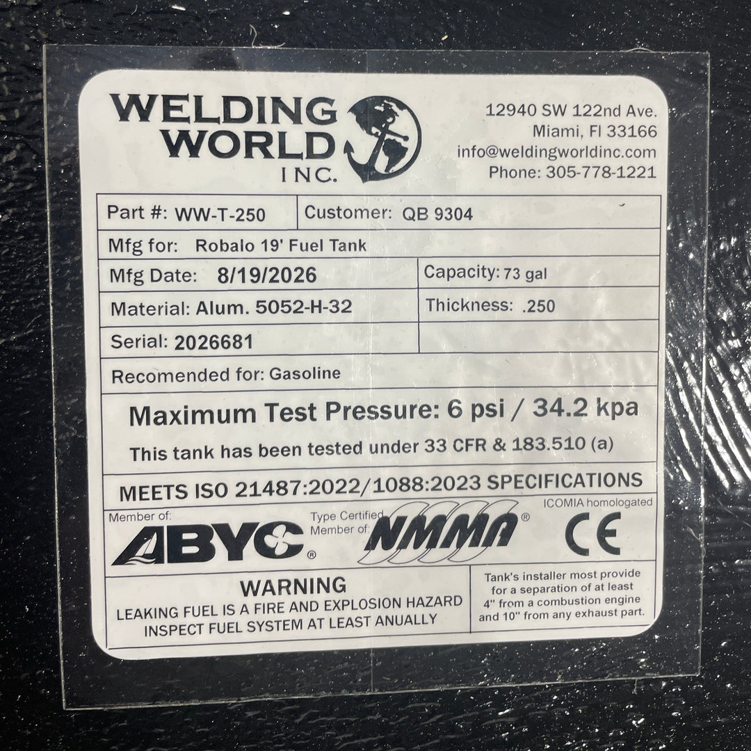A close-up studio detail view of the official manufacturer specification and compliance certification tag applied directly to the textured black TarGard epoxy coating of a finished Robalo 19 OEM replacement marine fuel tank (73 gal) from file image_281e14.jpg. Certified by Welding World Inc. in Miami, FL, the spec plate certifies part number WW-T-250, serial number 2026681, heavy-duty .250-thickness marine-grade Alum. 5052-H-32 construction, gasoline compatibility, 6 psi / 34.2 kPa maximum pressure testing 
