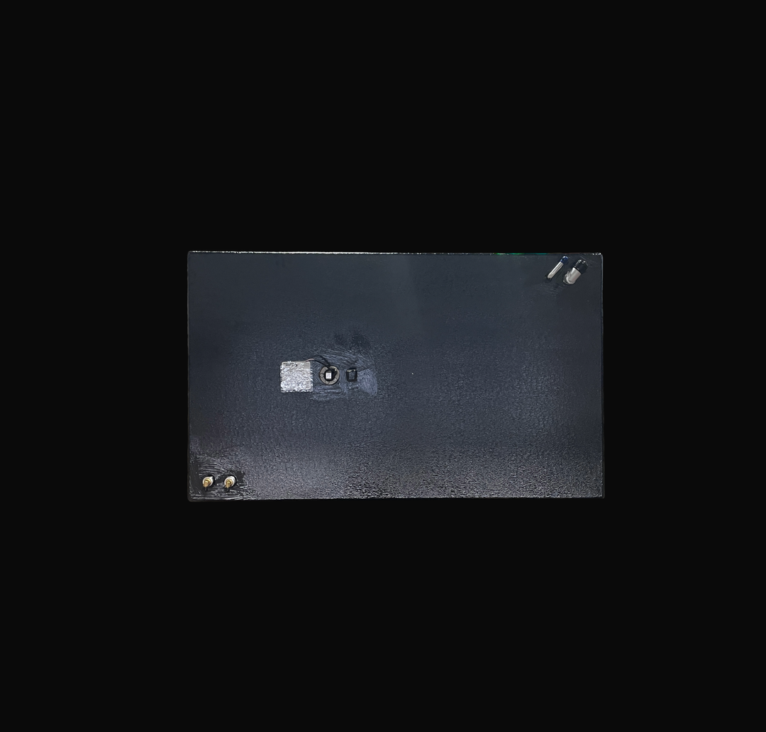 A studio top-down plan view displaying the deck configuration of a physical, finished black encapsulated Robalo 19 OEM replacement marine fuel tank (73 gal) from file image_280f2a.jpg, isolated against a black background. Precision-fabricated from heavy-gauge marine-grade 5052-H32 aluminum, the rectangular body is fully encapsulated in a protective, textured black TarGard epoxy coating to resist severe saltwater pitting and bilge moisture decay. Top deck hardware arrangement features dual brass 90-degree fu