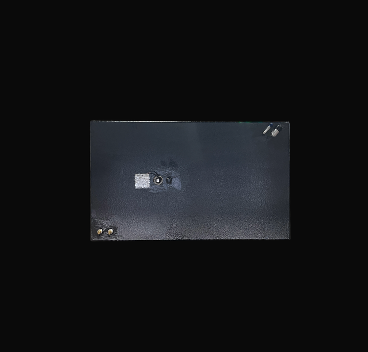 A studio top-down plan view displaying the deck configuration of a physical, finished black encapsulated Robalo 19 OEM replacement marine fuel tank (73 gal) from file image_280f2a.jpg, isolated against a black background. Precision-fabricated from heavy-gauge marine-grade 5052-H32 aluminum, the rectangular body is fully encapsulated in a protective, textured black TarGard epoxy coating to resist severe saltwater pitting and bilge moisture decay. Top deck hardware arrangement features dual brass 90-degree fu