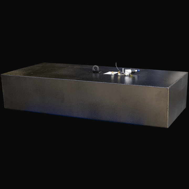 A large black rectangular fuel tank with a flat top surface viewed from a slight left front angle. The tank has multiple fuel system fittings and connectors on top, including capped tubes and wiring. It has a textured black finish with visible weld seams along the edges
