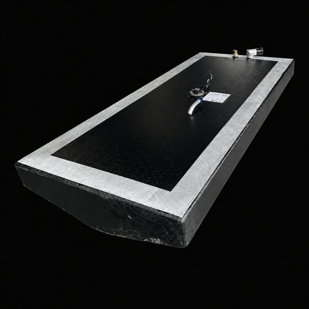 A low-angle isometric perspective view from the opposite end of a low-profile rectangular black Scout 16 replacement marine fuel tank. This 32-gallon capacity center-hull fuel cell is precision-fabricated by Welding World from heavy-gauge marine-grade 5052-H32 aluminum, highlighting its low-profile angled bottom profile designed to seat flush within the boat's central bilge cavity. The main body surfaces are coated in a protective, anti-corrosive, textured black TarGard epoxy finish while showing a bare sil