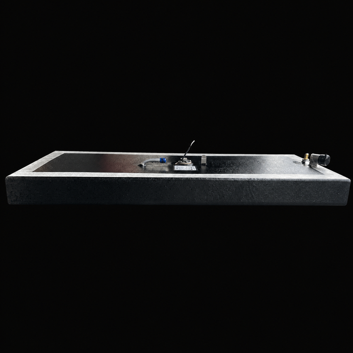 A full side-elevation perspective view of a low-profile rectangular black Scout 16 replacement marine fuel tank. This 32-gallon capacity center-hull fuel cell is precision-fabricated by Welding World from heavy-gauge marine-grade 5052-H32 aluminum, showcasing a slim 7" depth designed to fit within tight factory bilge compartments. The structure features a semi-encapsulated design with a protective, textured black TarGard epoxy finish across the main surfaces while revealing a clean silver raw aluminum borde