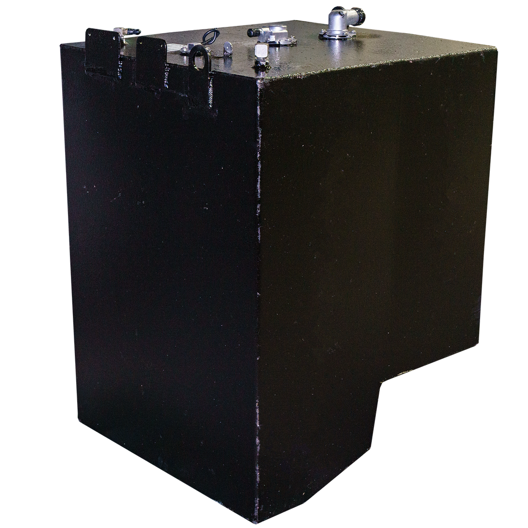 Black rectangular metal fuel tank with a matte finish, viewed at an angle. The tank features several metal fittings, pipe connections, and lifting brackets on the flat top surface. The bottom front edge has a notched cutout, and the surface shows minor scuff marks, all set against a transparent checkered background