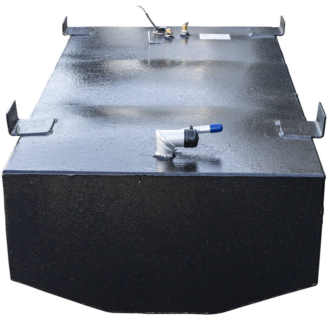 A black, rectangular fuel tank with a slightly rounded front edge, viewed from the front. The top surface has a textured finish and features several metal fittings, including a light-colored pipe with a blue tip on the right, and other metallic components on the left. Four L-shaped metal brackets are attached to the edges of the tank