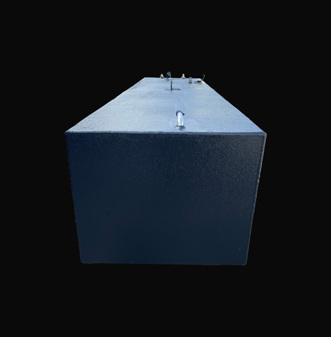 A rear profile end view looking down the length of a SeaVee 25 main replacement marine fuel tank with a 147-gallon capacity. This perspective showcases its rectangular body and premium textured black TarGard epoxy finish designed for robust corrosion resistance in marine bilges. A dedicated vent fitting is visible in the foreground on the top deck, while a central lifting ring, fuel level sending unit, and brass pickup clusters line the far edge. Precision-engineered from heavy-duty marine-grade 5052-H32 al