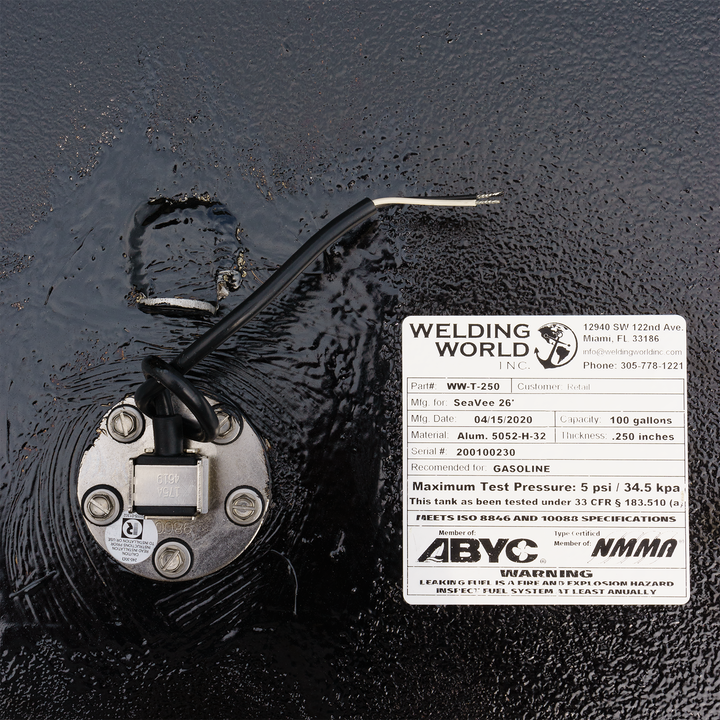 Close-up of a SeaVee 26' 2-Tank Combo fuel tank kit featuring a 100-gallon and a 33-gallon tank. The image shows a fuel sender unit with wiring and a label detailing specifications, including a maximum test pressure of 5 psi and compliance with ABYC standards