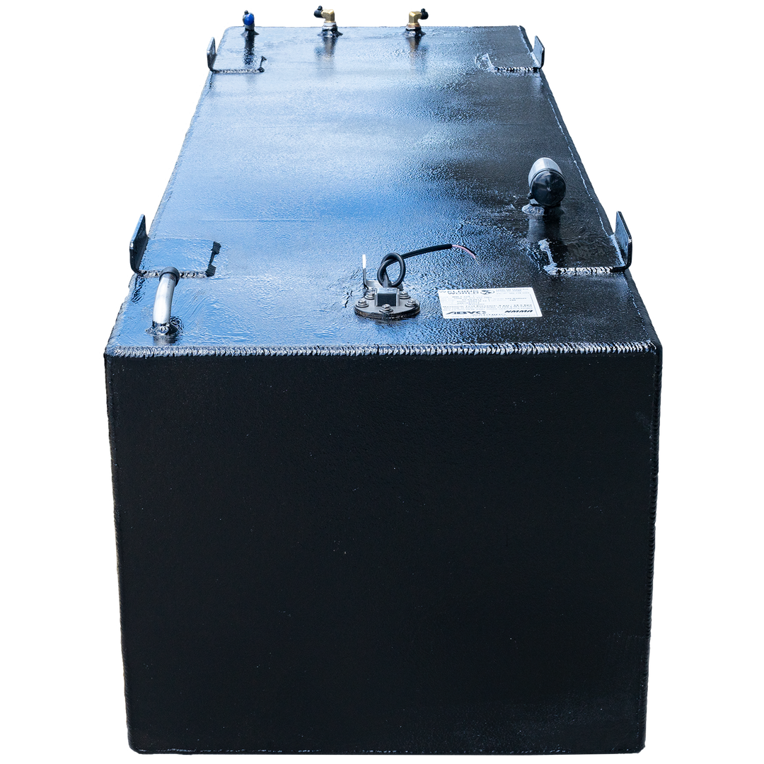 A black rectangular fuel tank, possibly a SeaVee 29' 2003 back fuel tank, with a textured surface is shown against a checkerboard transparent background. The top of the tank features multiple metal fittings, including brass-colored connectors, a blue-capped pipe, a circular cap with exposed wires, and an additional circular cap