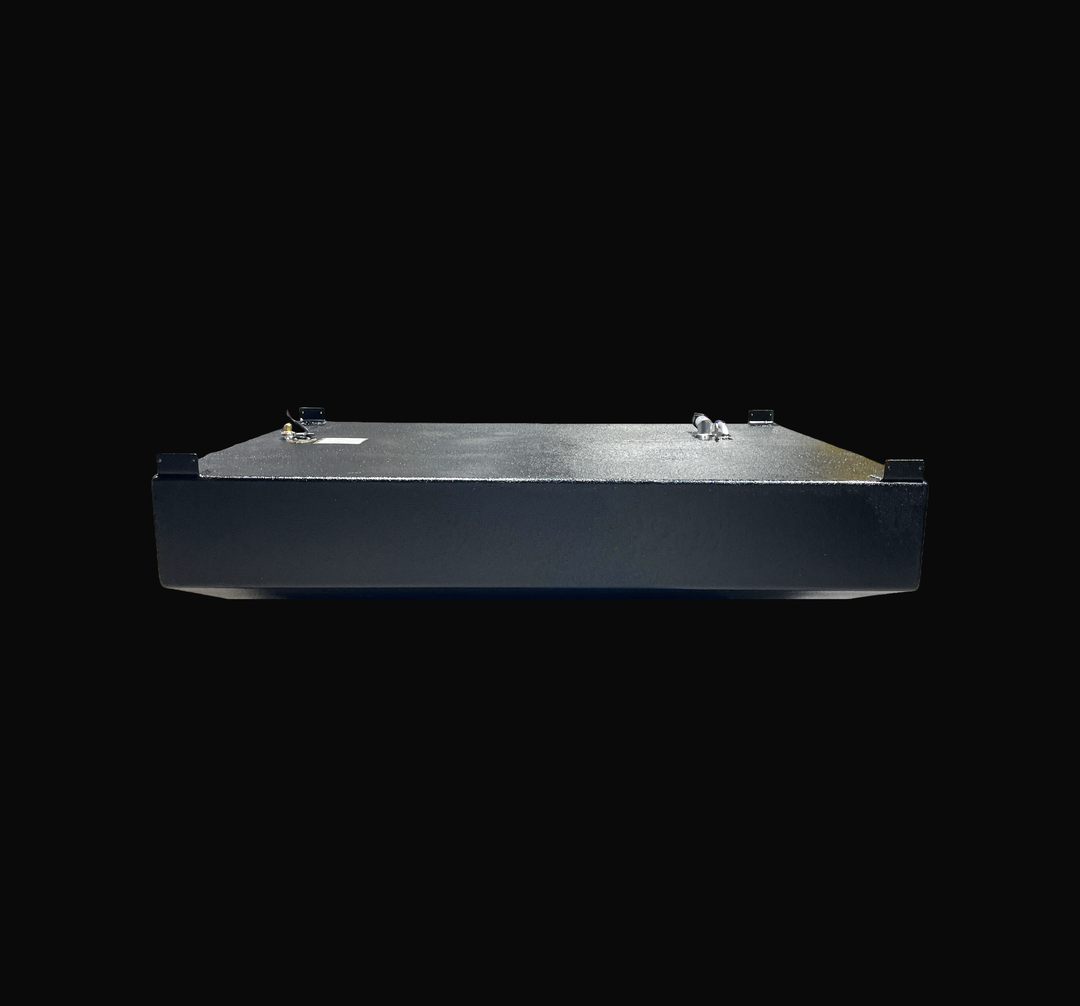 An eye-level studio side profile view displaying the full length of a physical, finished black encapsulated WellCraft 23.8 CCF 1994 OEM replacement marine fuel tank (137 gal) from file image_5c8142.png, isolated against a black background. Precision-fabricated from heavy-gauge marine-grade 5052-H32 aluminum, the low-profile hull-contoured body is fully encapsulated in a protective, textured black TarGard epoxy coating to resist severe saltwater pitting and bilge moisture decay. Top deck hardware features fo