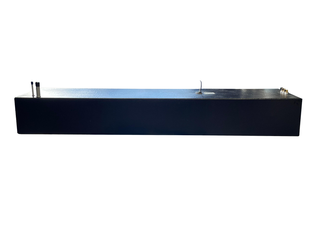 A long side profile photo of a dark, textured boat fuel tank, showing various fittings on its top surface, against a transparent checkerboard background.